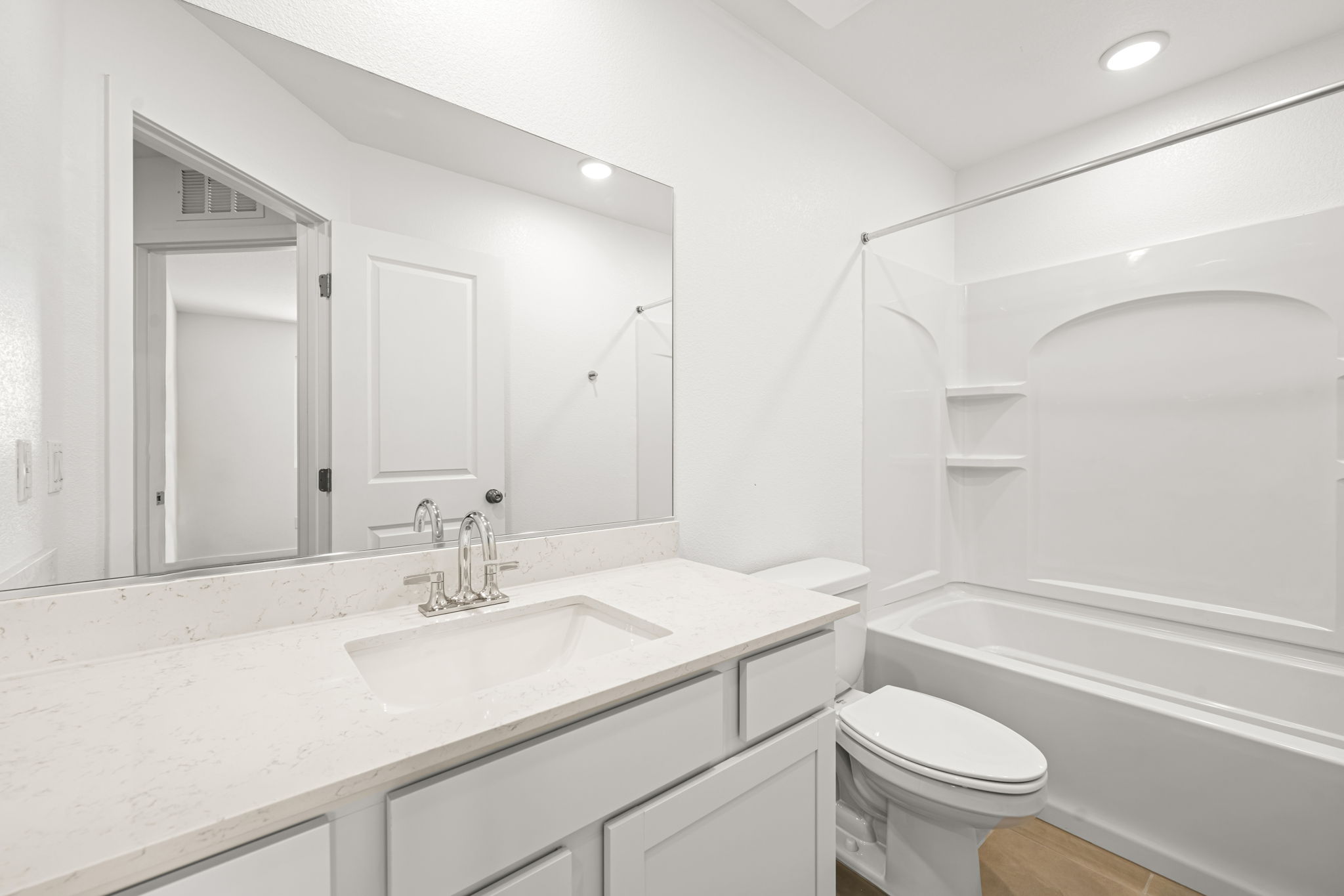 A bathroom with a sink and a toilet.