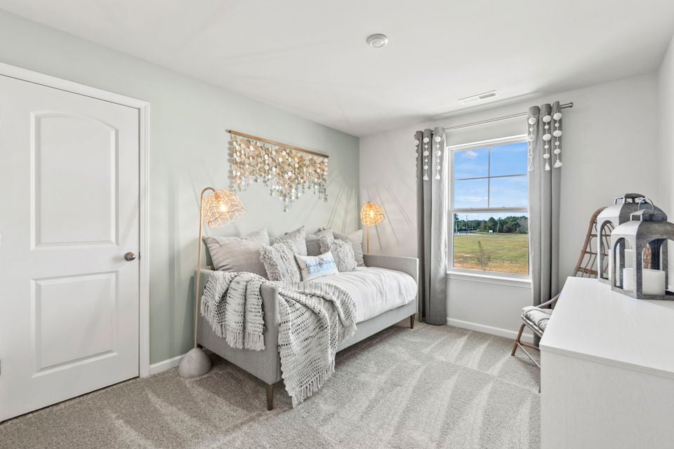 A bedroom with a large bed.