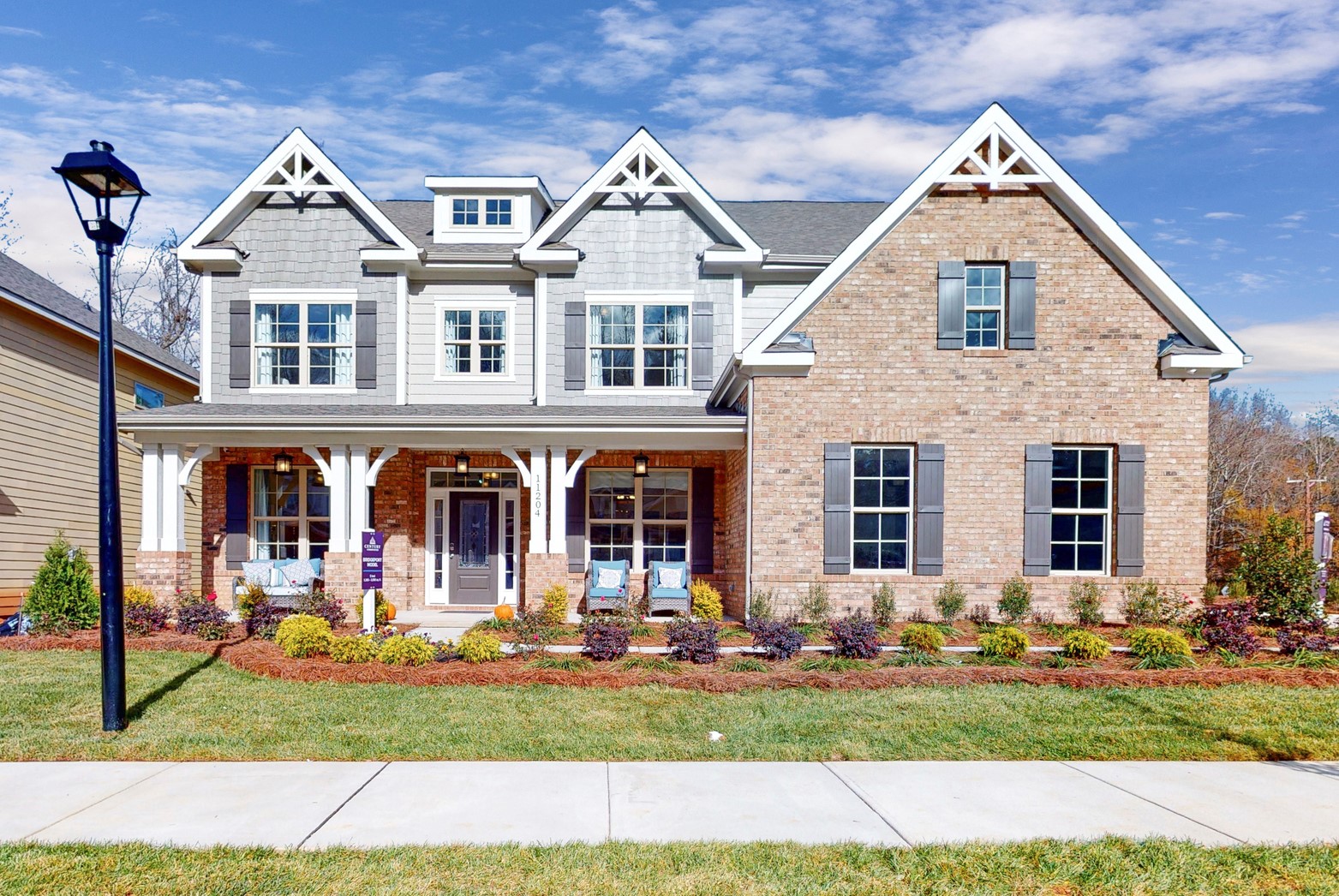 A large house with a lawn in front of it.