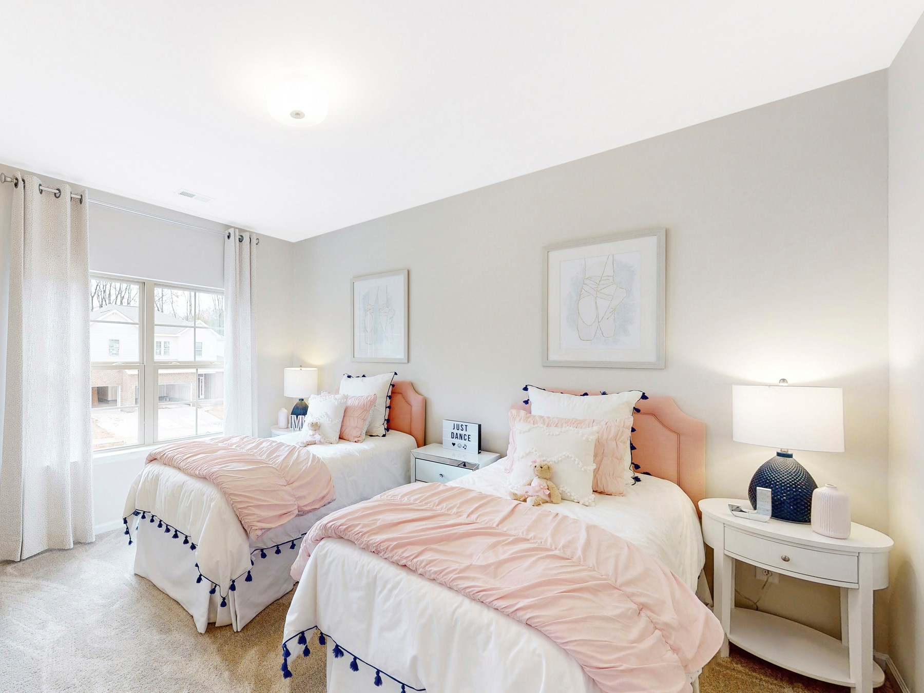 A bedroom with two beds.