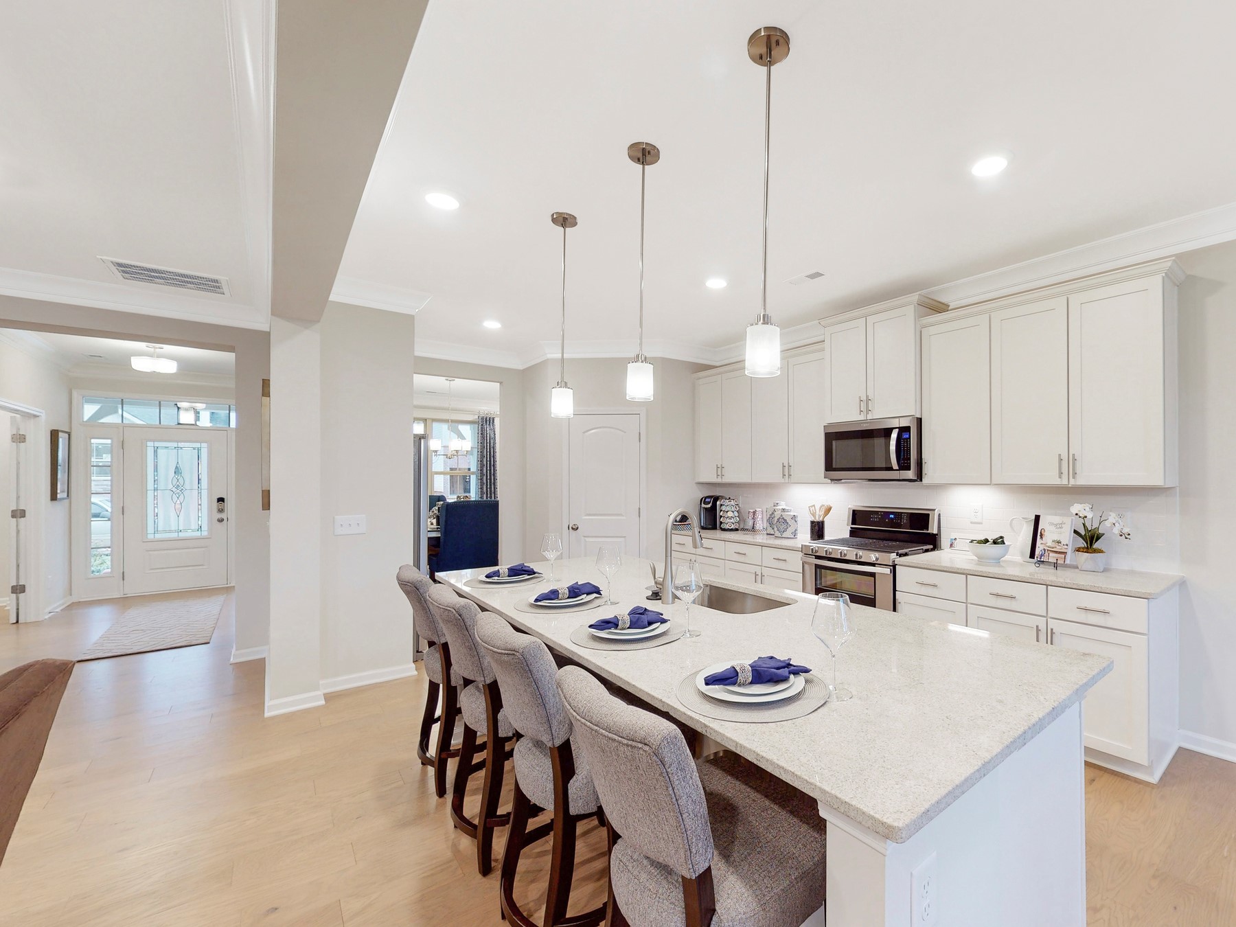 A kitchen with a dining table.
