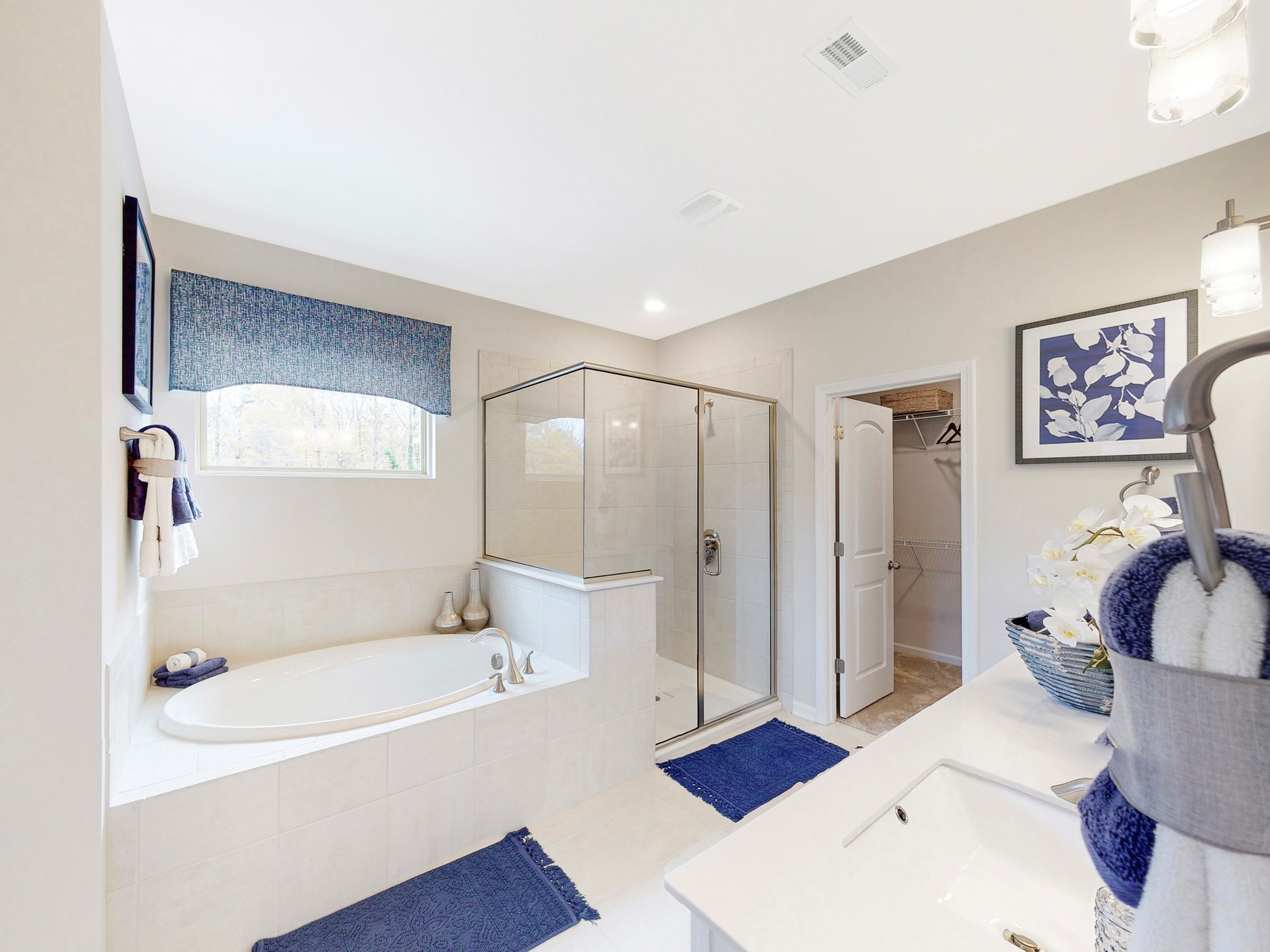 A bathroom with a tub and sink.