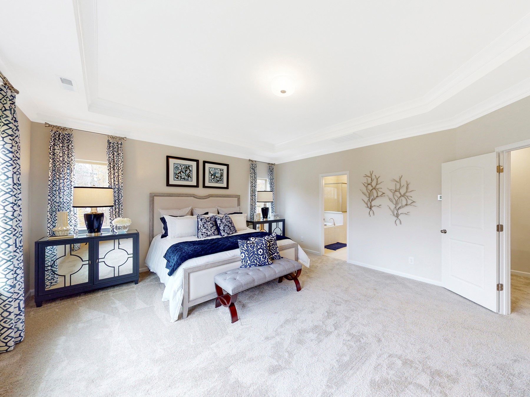 A bedroom with a bed and a couch.