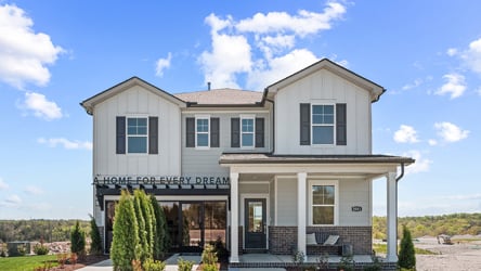 A white house with a blue sky.