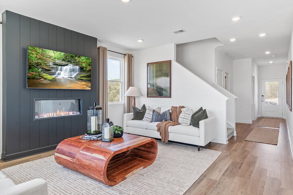 A living room with a fireplace.