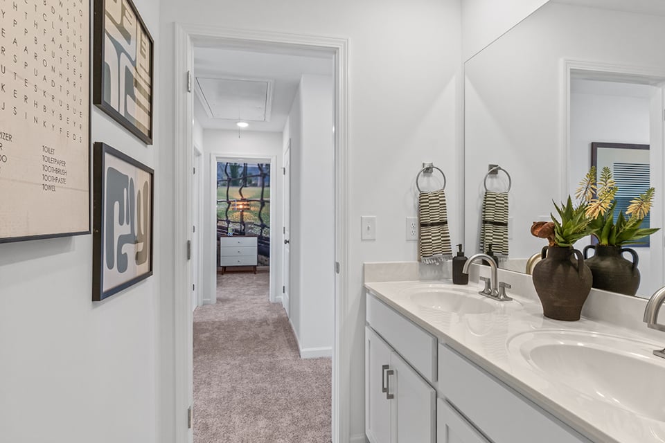 A bathroom with a sink and a mirror.