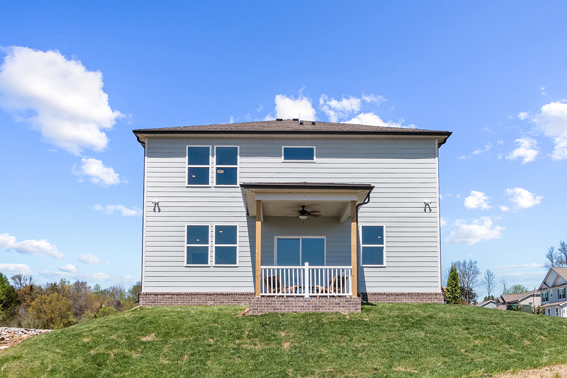 A house with a grass yard.