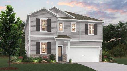 A white house with a driveway.