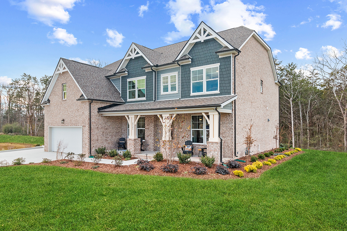 A house with a large front yard.