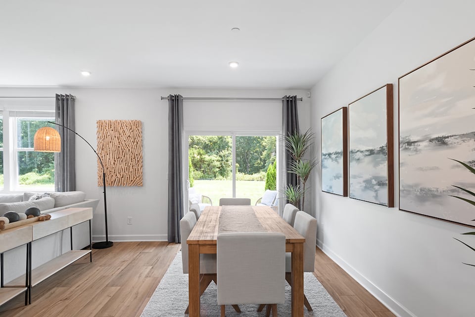 A room with a table and chairs.