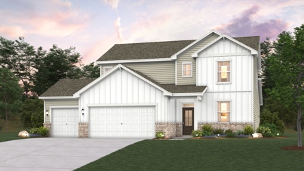 A white house with a green lawn.