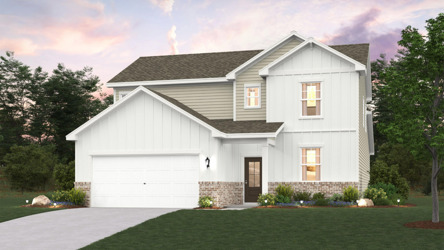 A white house with a driveway.