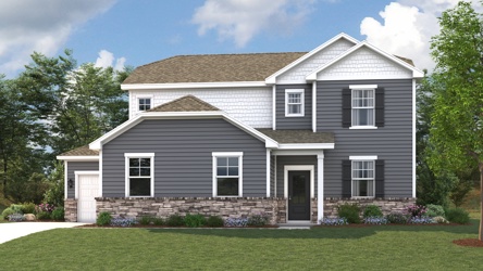 A house with a lawn in front of it.