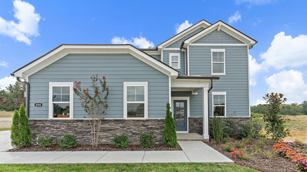 A house with a large front yard.