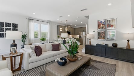A living room with a large rug.
