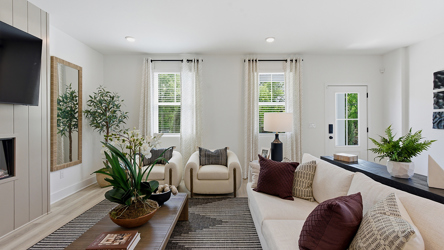 A living room with a couch and a table.