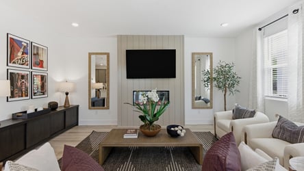 A living room with a tv and couches.