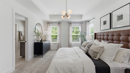 A bedroom with a bed and a couch.