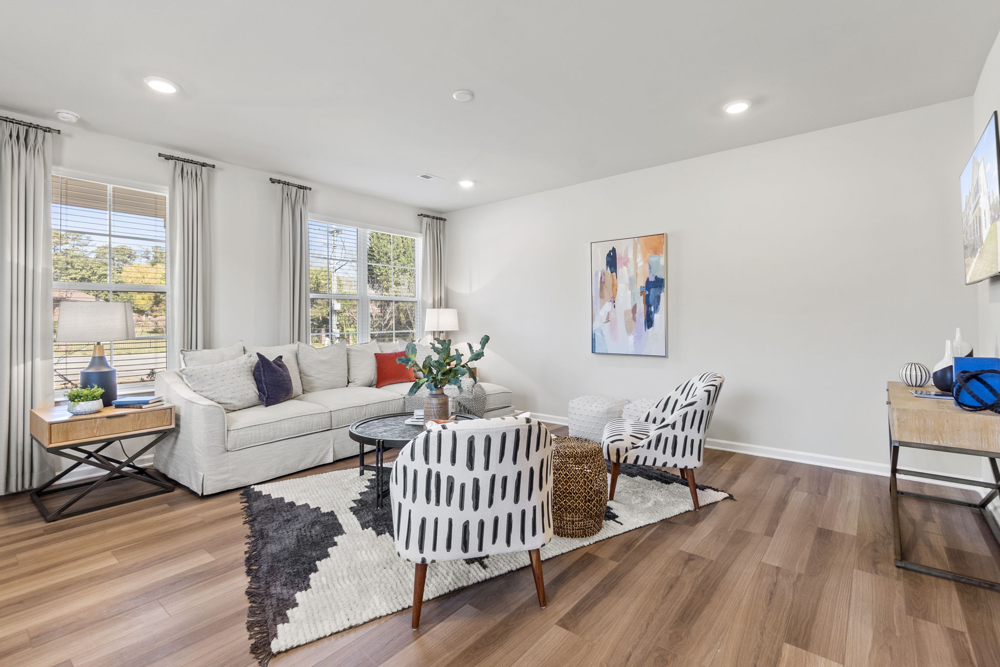 A living room with a wood floor.