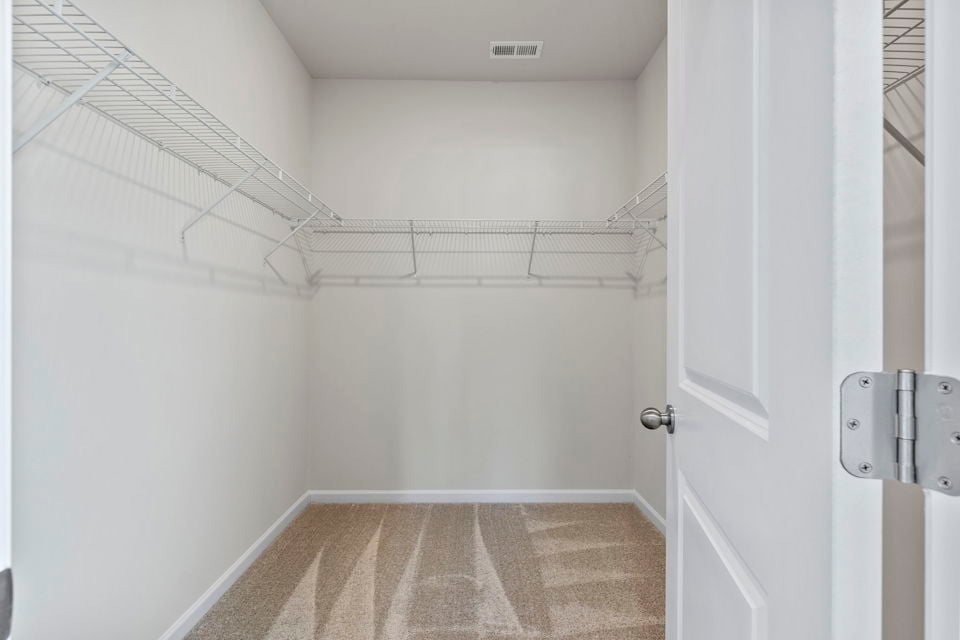 A shower with a tile floor.