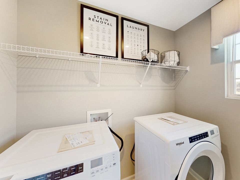 A laundry room with a washer and dryer.