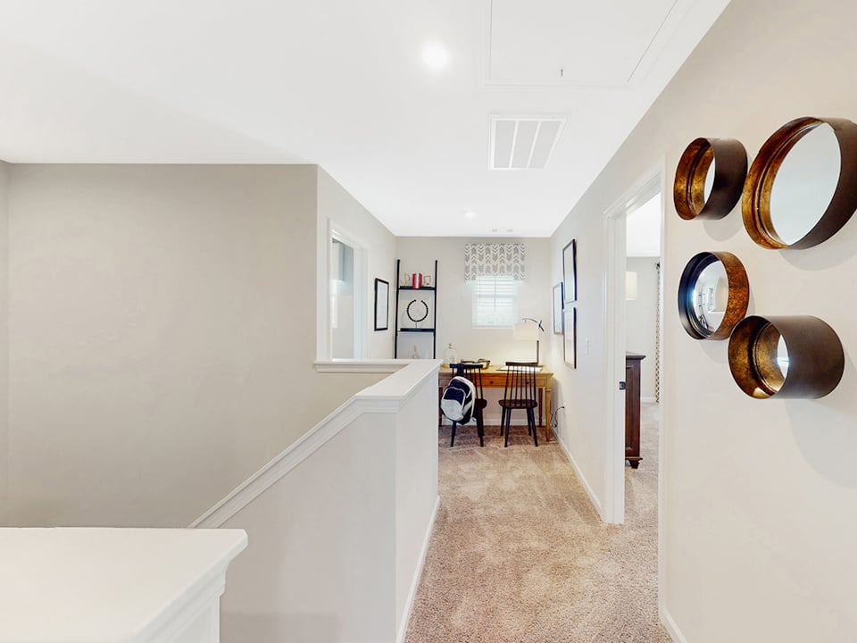 A room with a table and chairs.