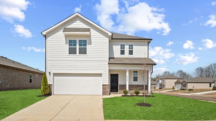 A white house with a driveway.