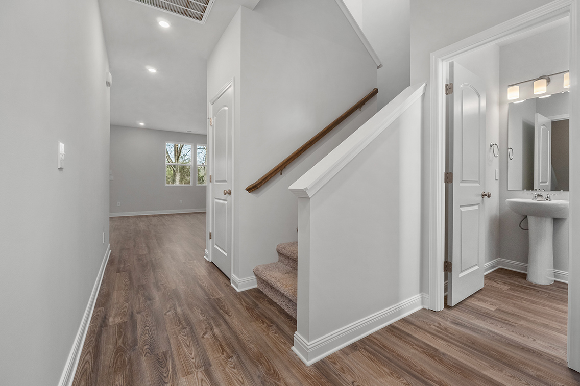A bathroom with a wood floor.