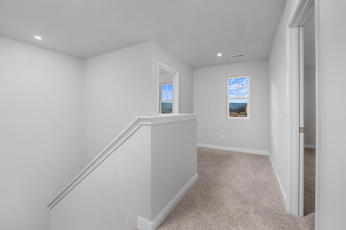 A hallway with white walls.