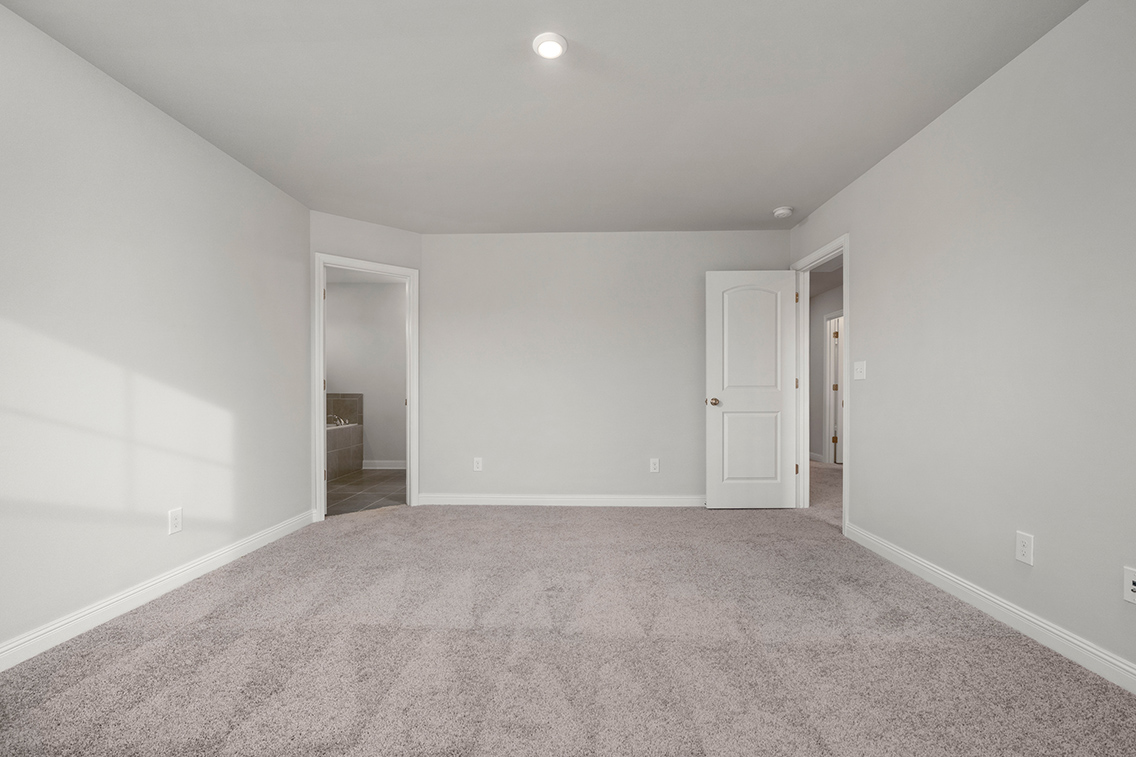 A hallway with white walls.