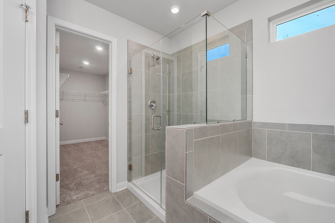 A bathroom with a glass shower.