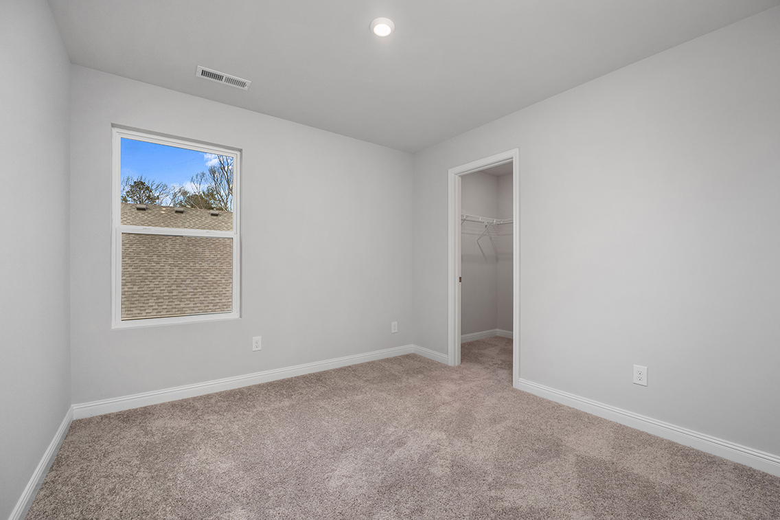 A room with a window and a door.