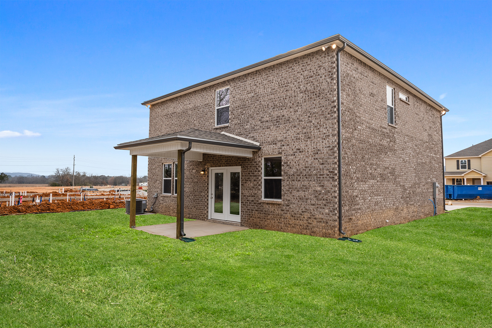 A house with a grass yard.