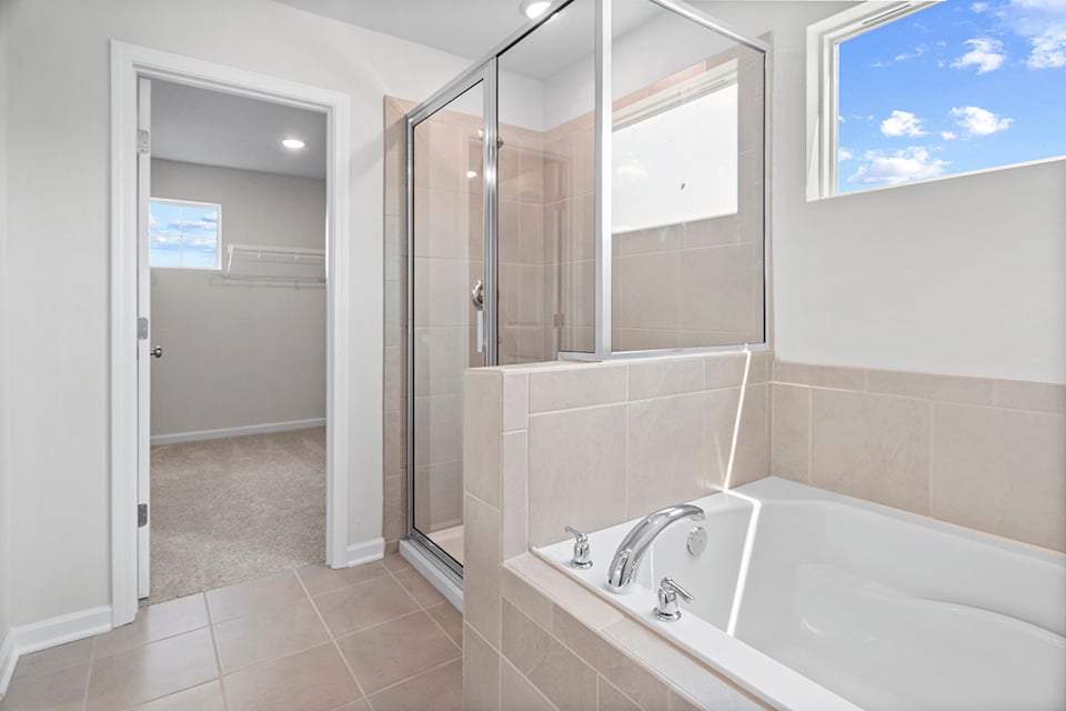 A bathroom with a glass shower.
