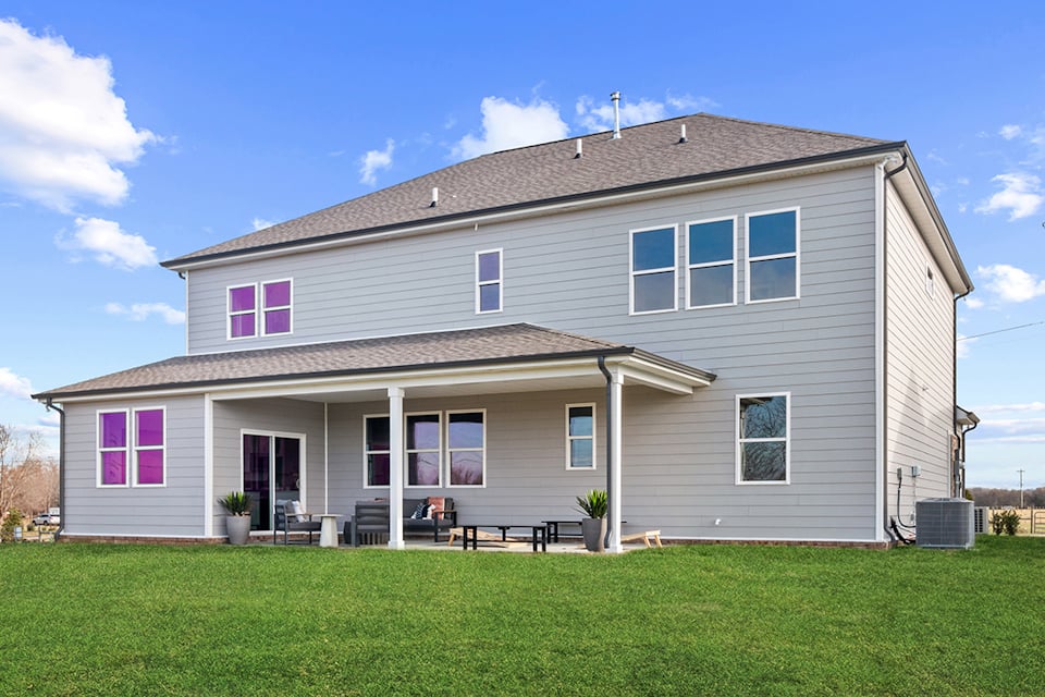 A house with a lawn in front.