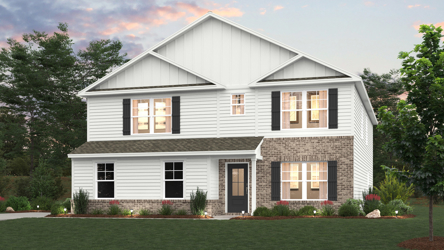 A white house with a lawn in front of it.