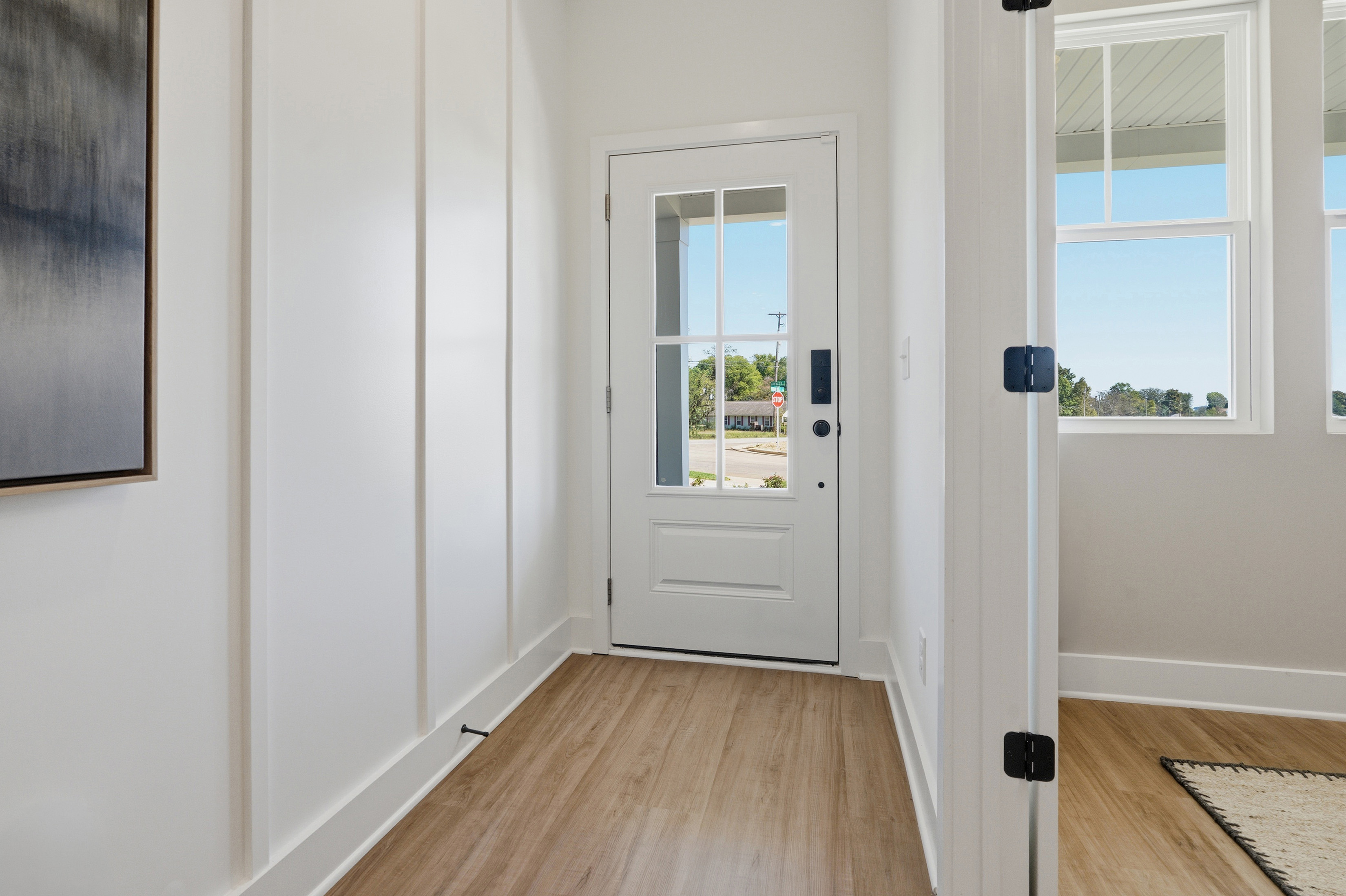 A room with a door and windows.