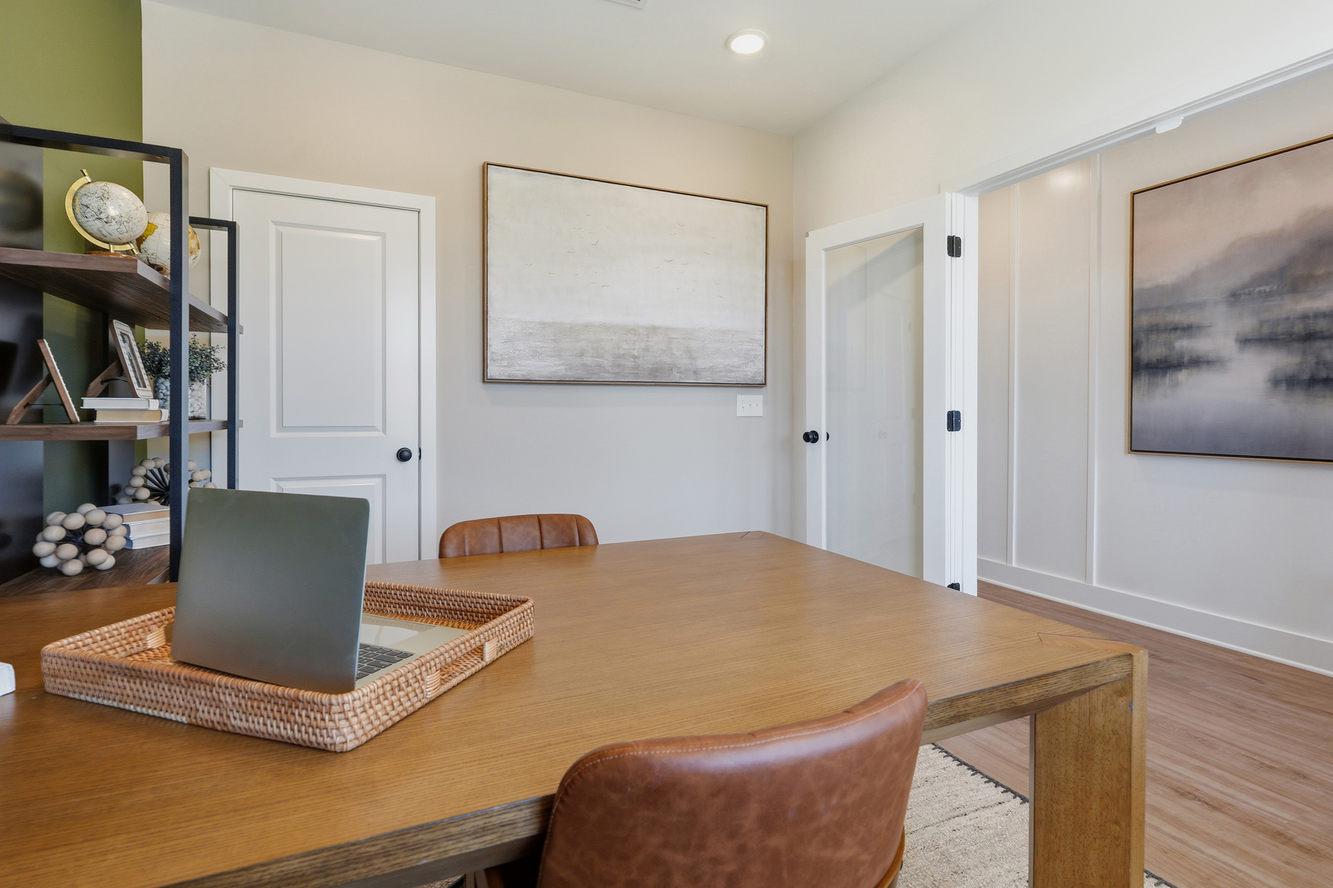 A room with a table and chairs.