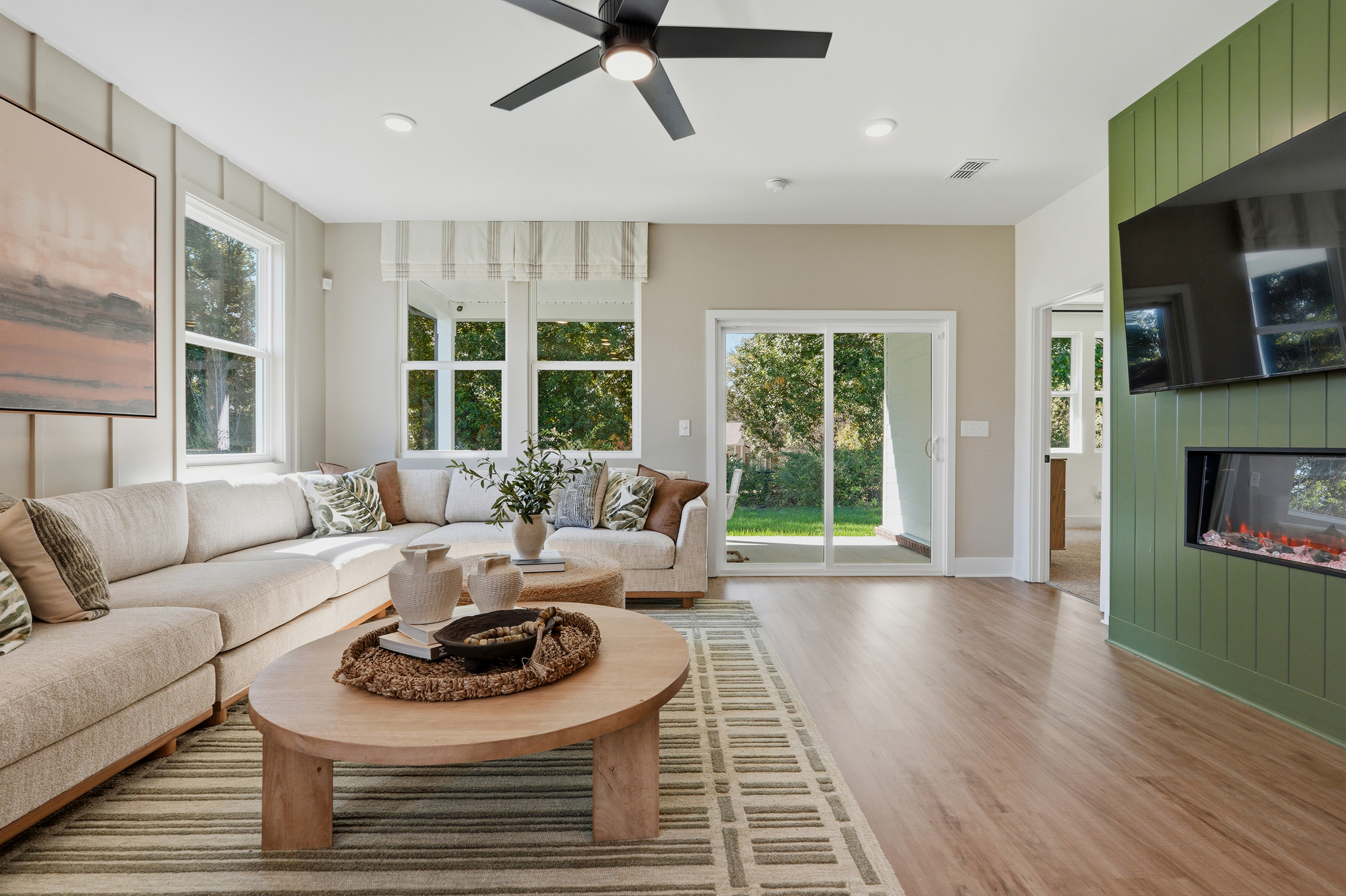A living room with a couch and a table.