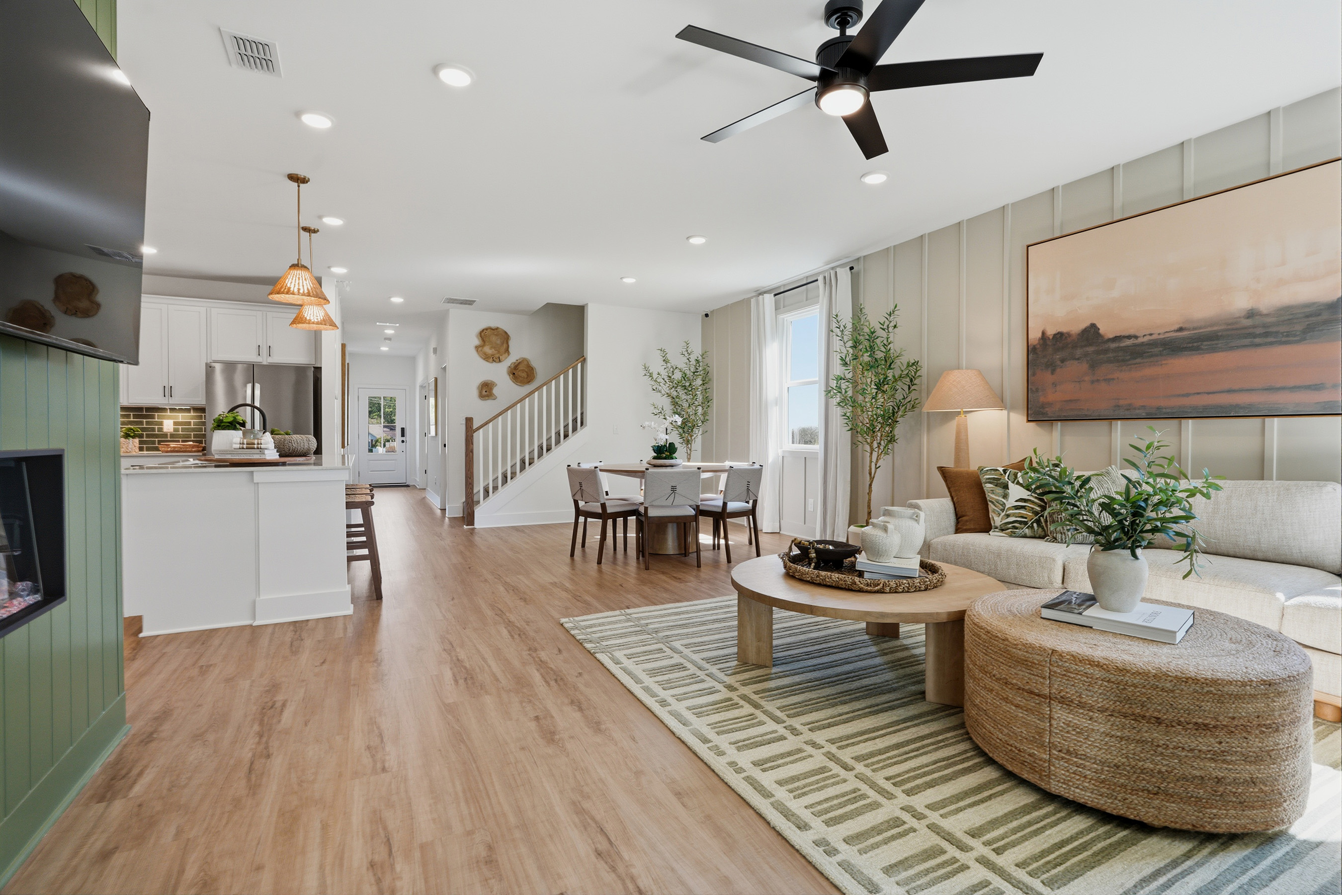 A living room with a wood floor.