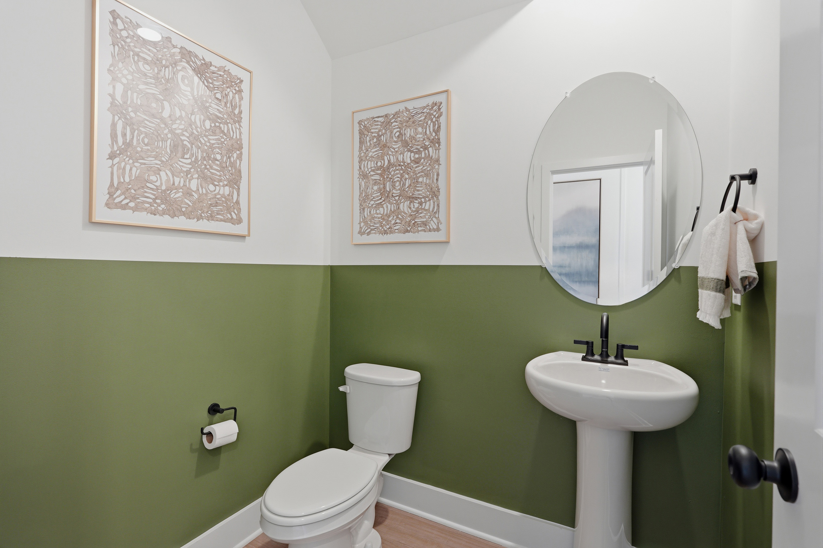 A bathroom with a mirror and sink.