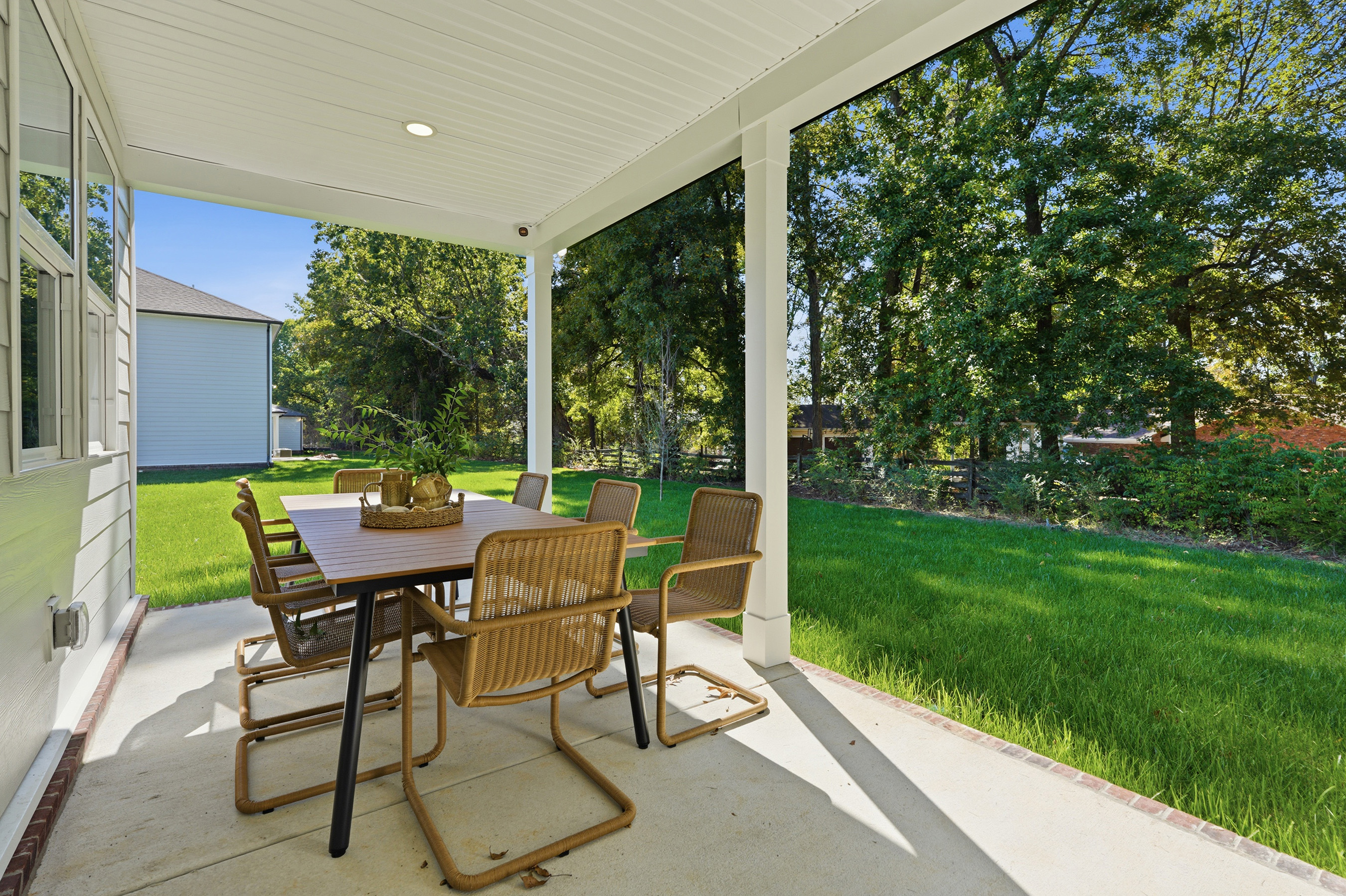 A table and chairs on a patio.