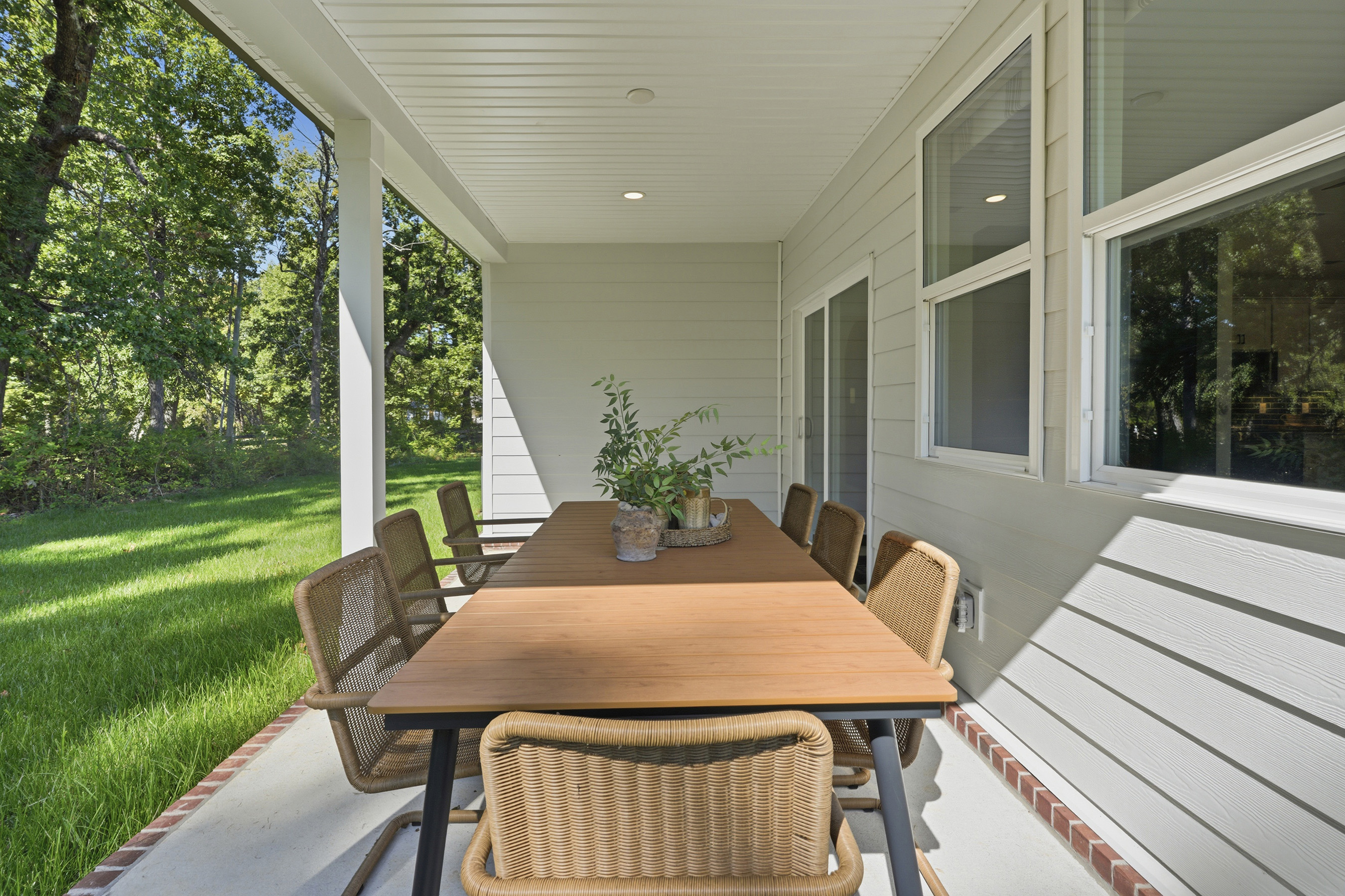 A table and chairs on a deck.