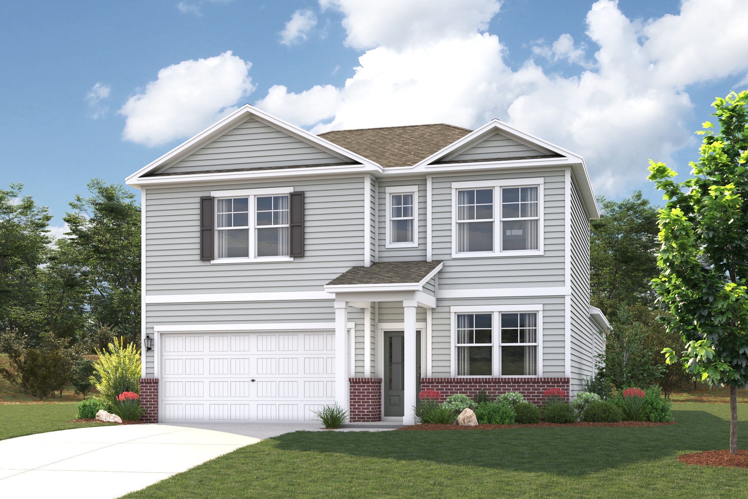 A white house with a lawn and trees in the front.