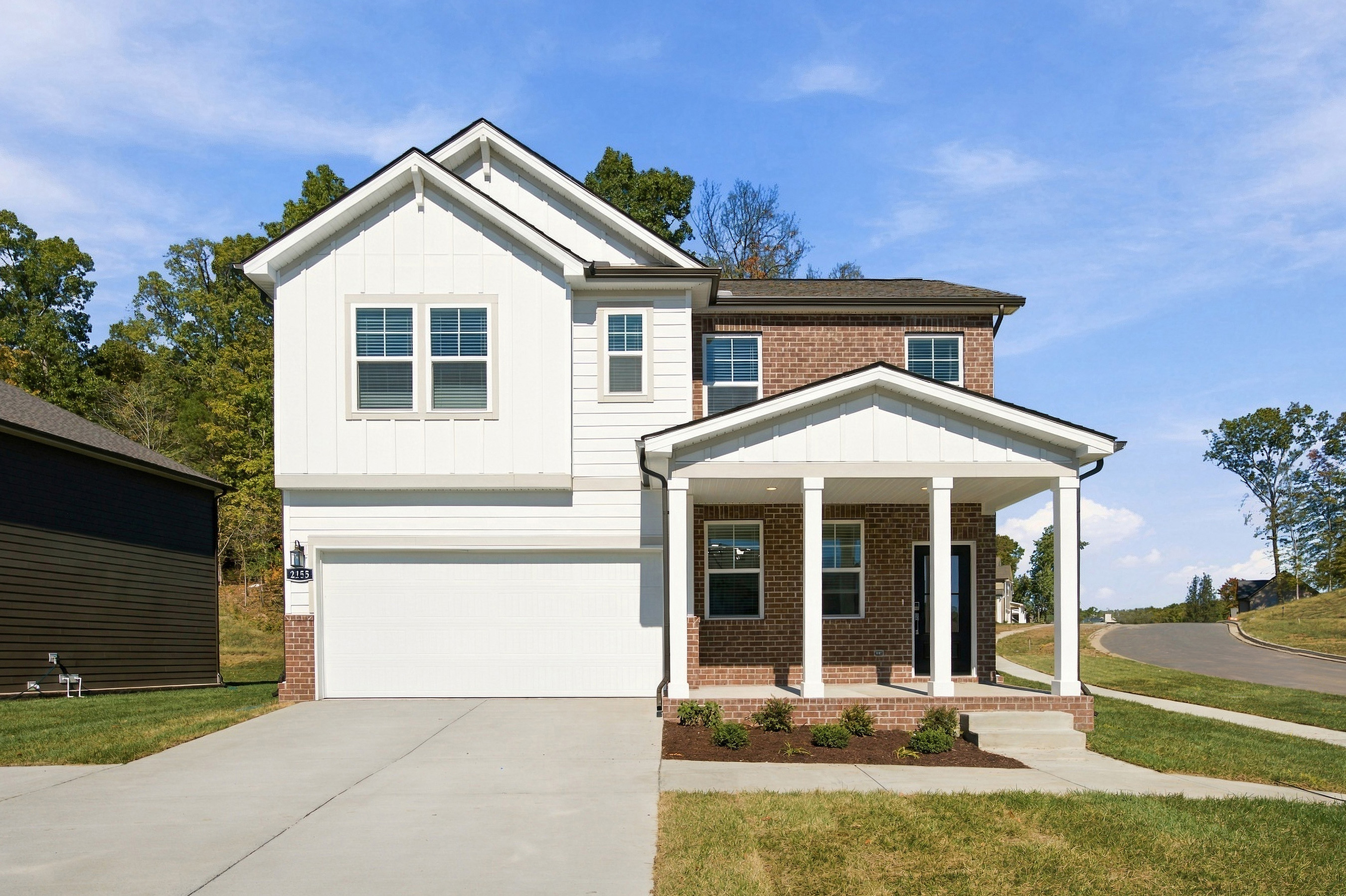 A white house with a porch.