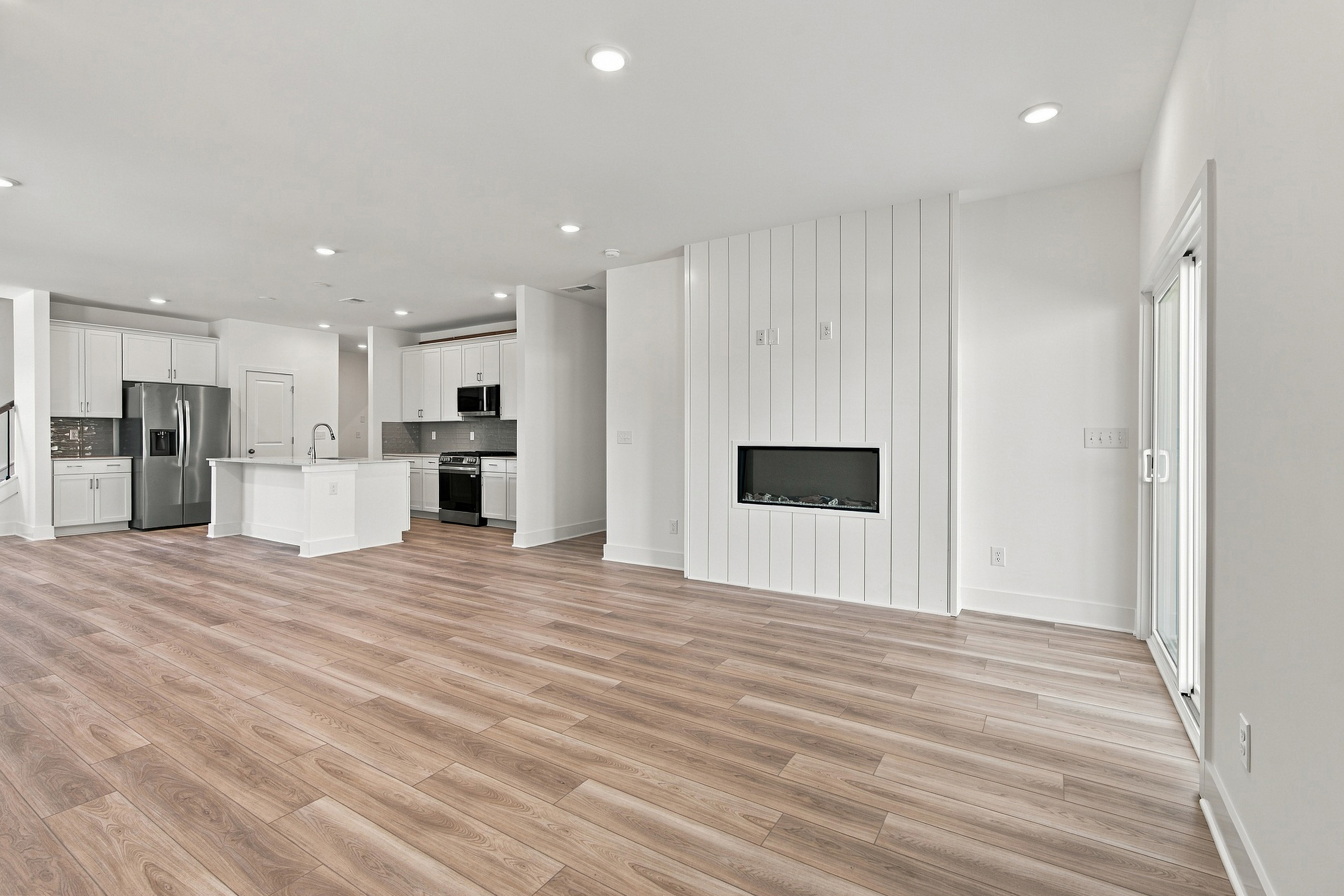 A large kitchen with white cabinets.