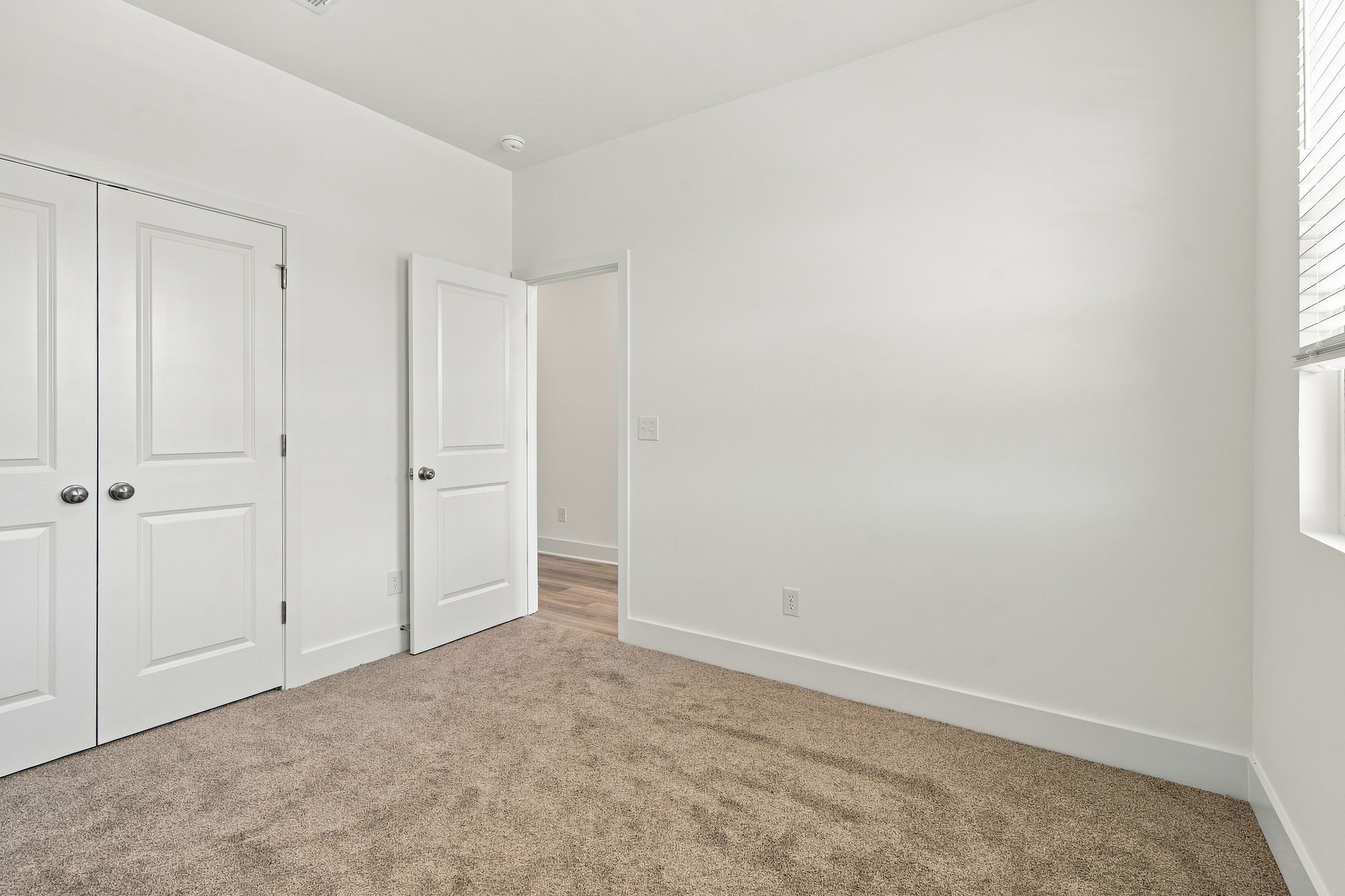 A room with white doors.