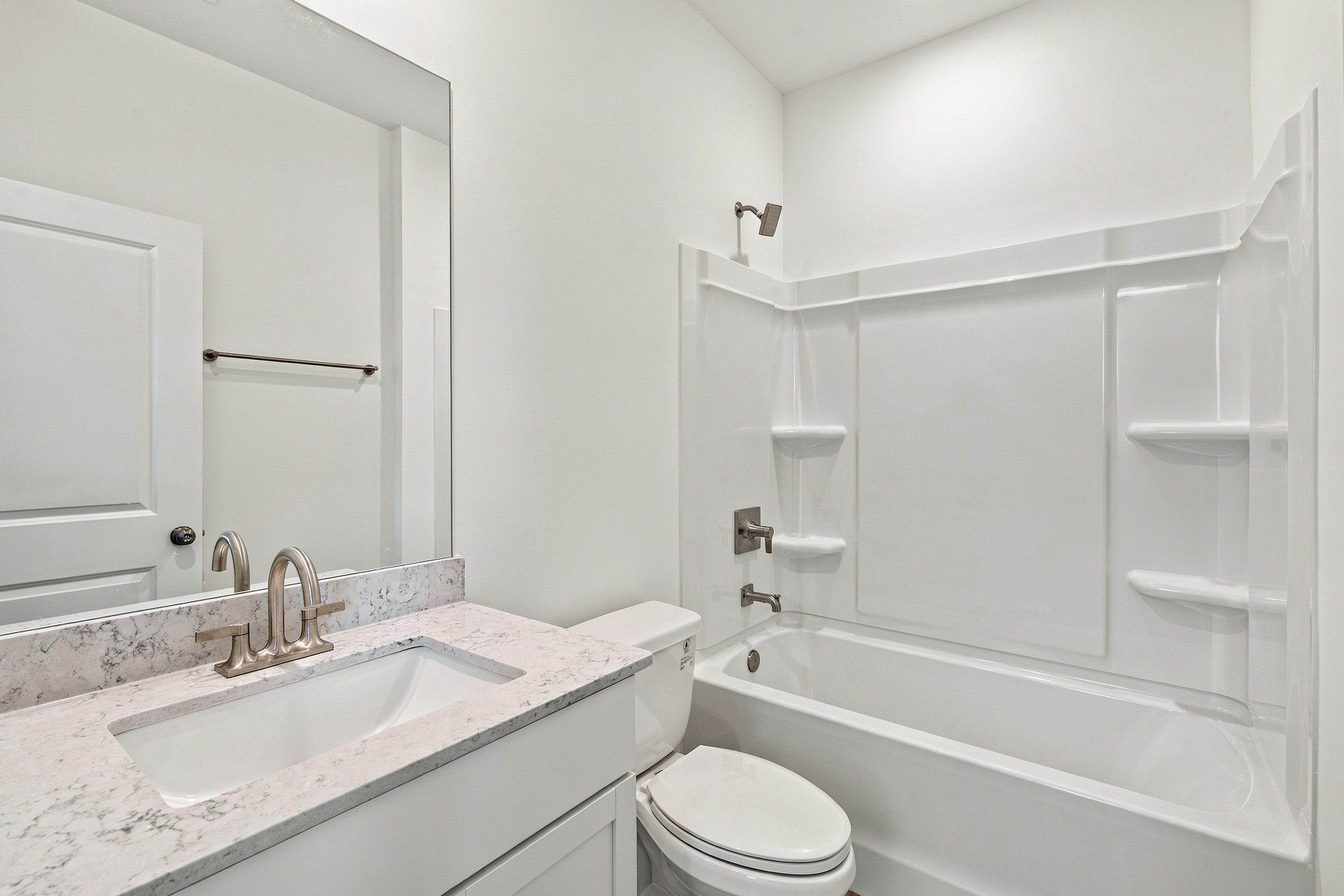 A bathroom with a sink and a toilet.
