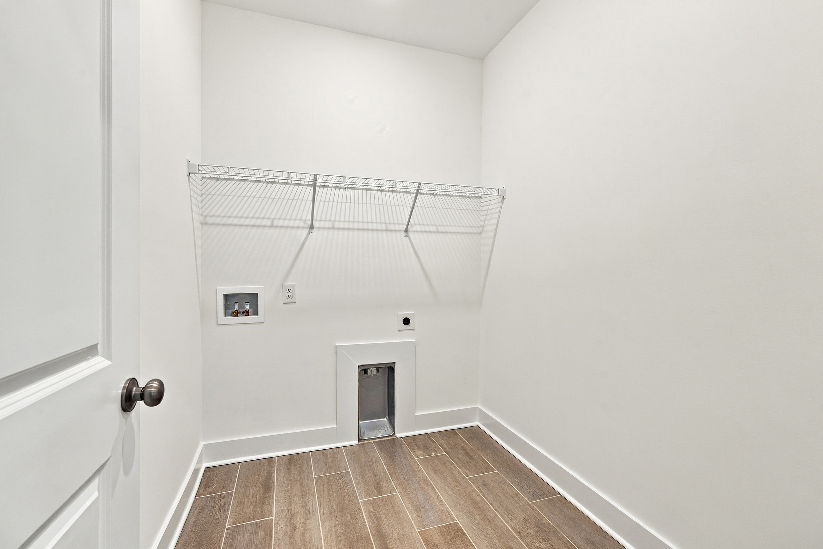 A room with a shower and a door.