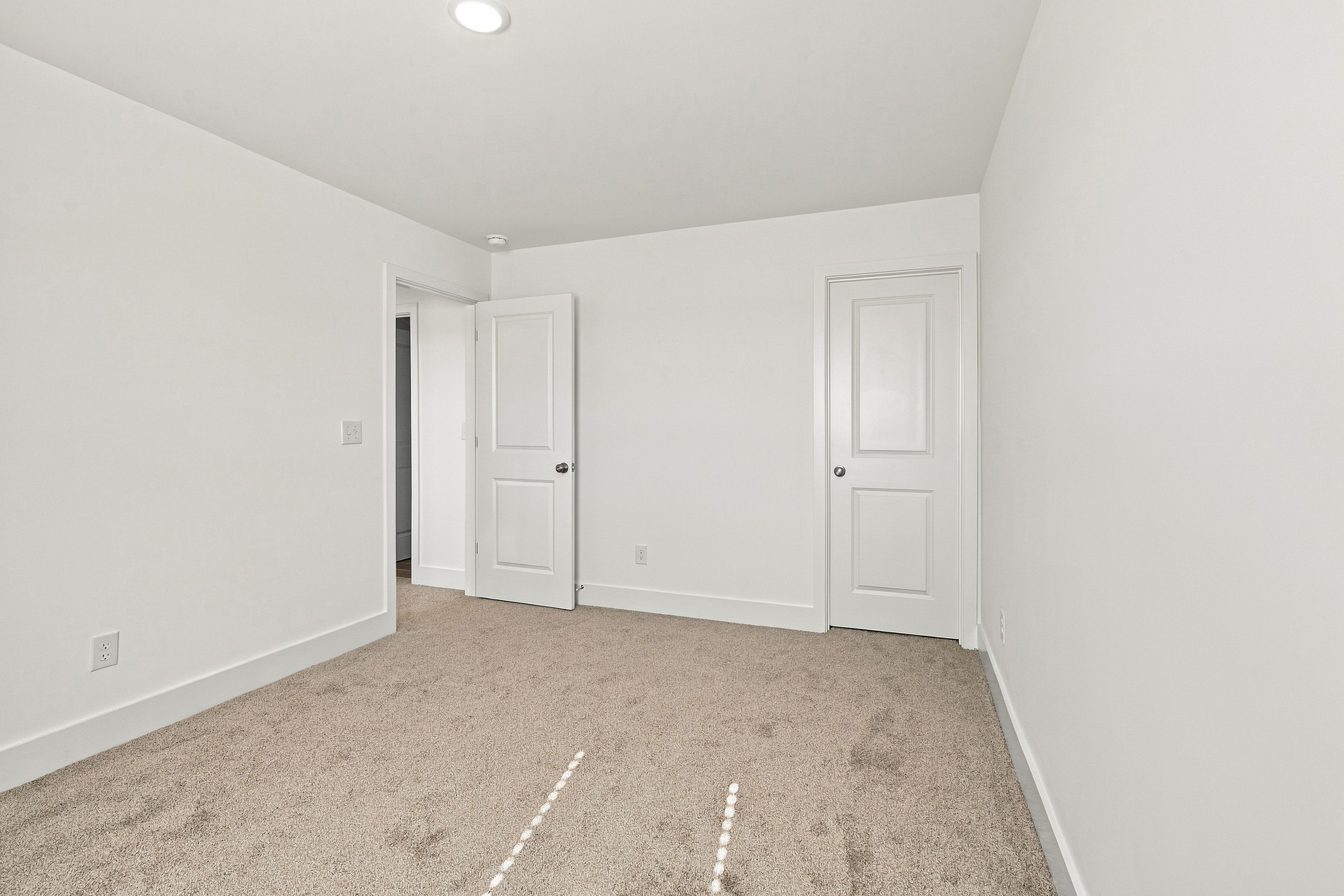 A room with white doors.